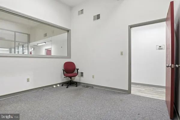 a white toilet sitting next to a small bathroom