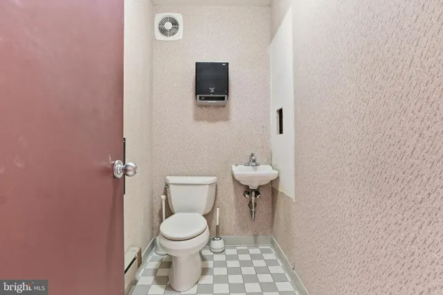 a view of staircase with white walls