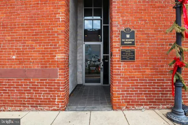 a view of a brick building with many windows