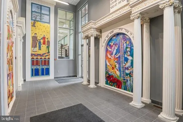 a view of an entryway with wooden floor