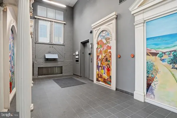 a view of kitchen with furniture and wooden floor