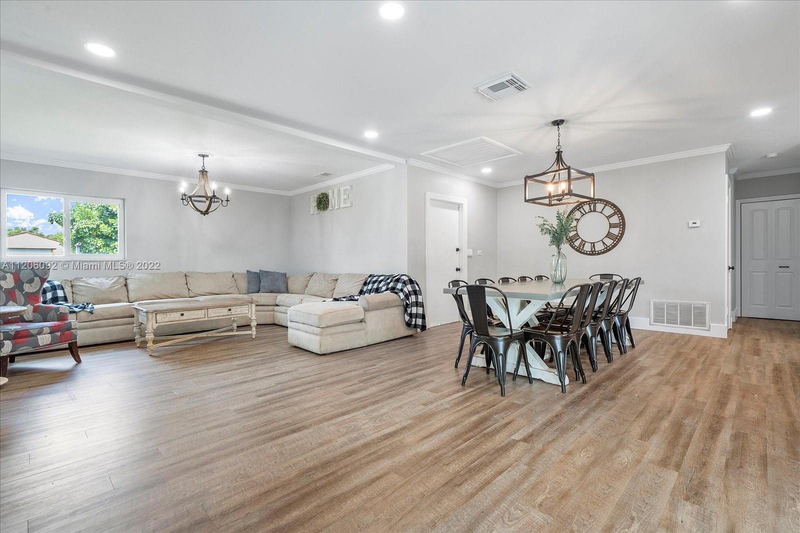 17300 Southwest 294th Street Homestead, FL 33030 - Photo 11 of 50 a living room with furniture and wooden floor