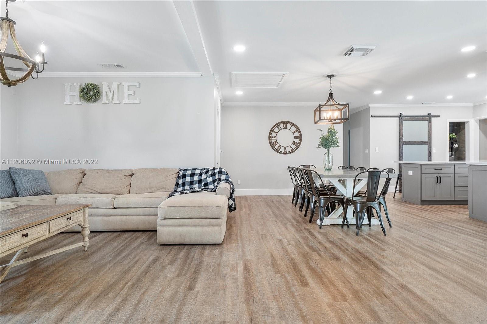 17300 Southwest 294th Street Homestead, FL 33030 - Photo 12 of 50 a living room with furniture and wooden floor