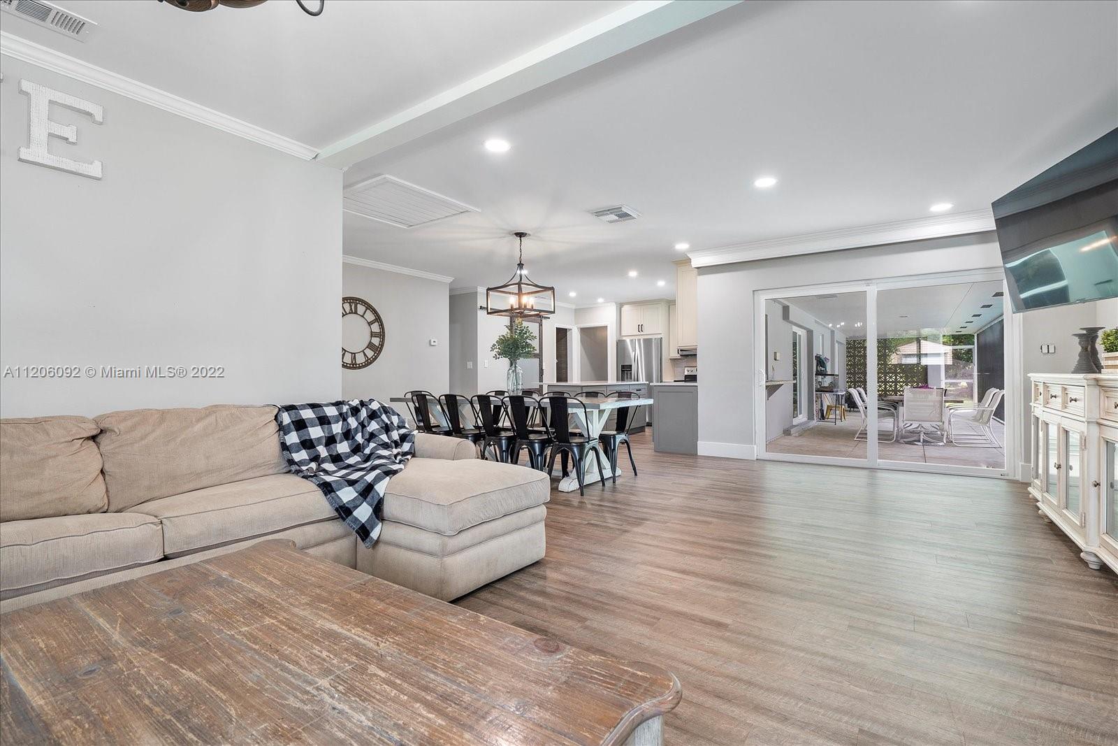 17300 Southwest 294th Street Homestead, FL 33030 - Photo 14 of 50 a living room with furniture and wooden floor