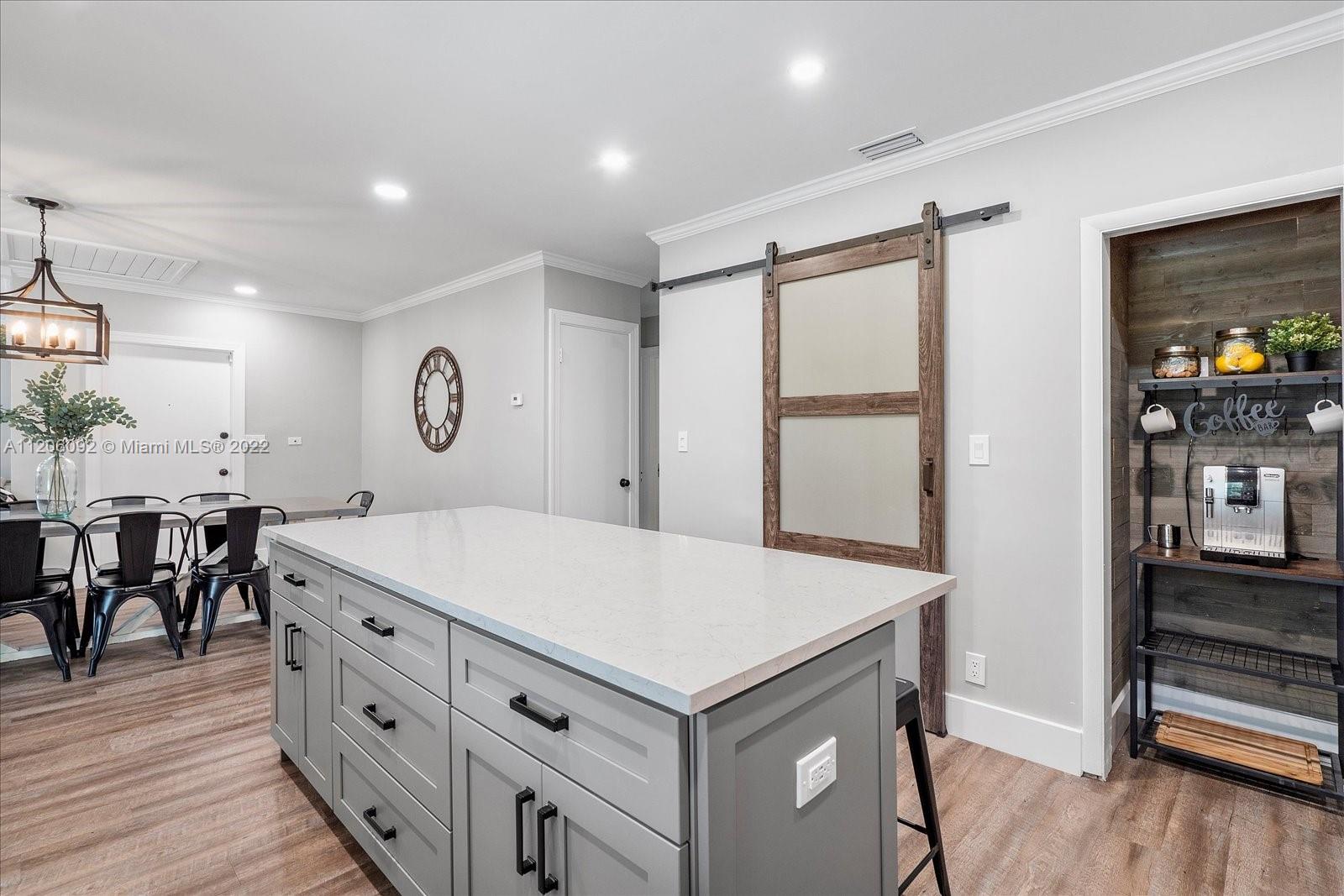 17300 Southwest 294th Street Homestead, FL 33030 - Photo 19 of 50 a view of kitchen with cabinets and wooden floor