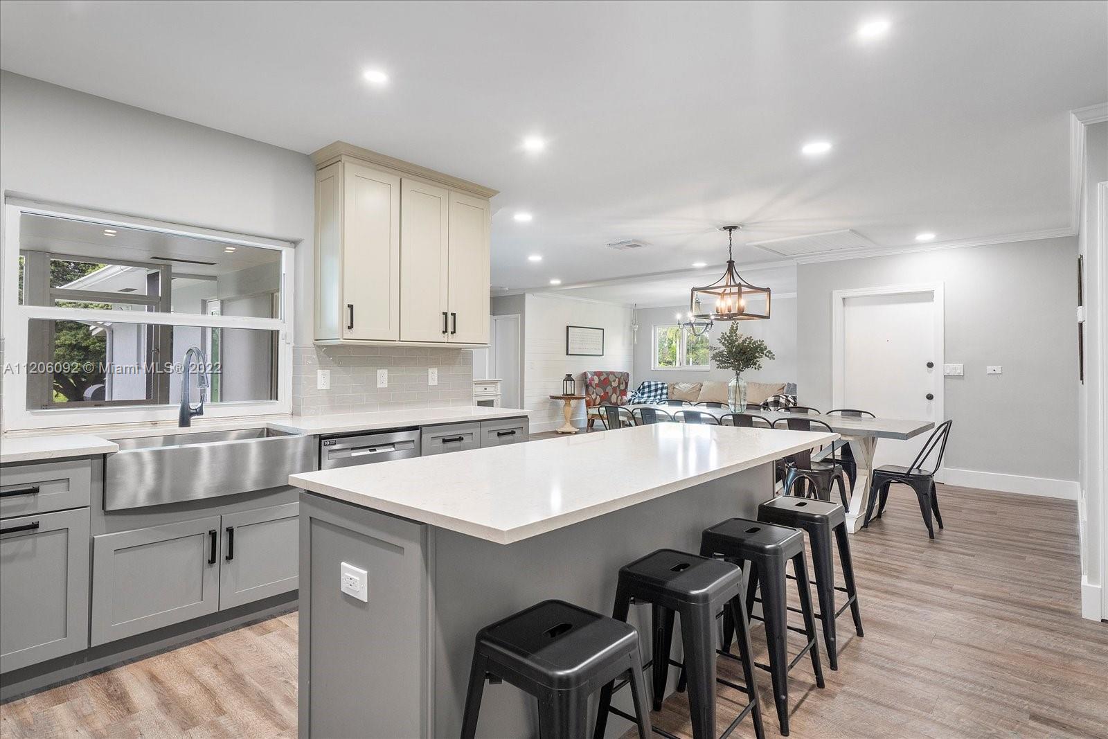17300 Southwest 294th Street Homestead, FL 33030 - Photo 20 of 50 a large kitchen with a table and chairs