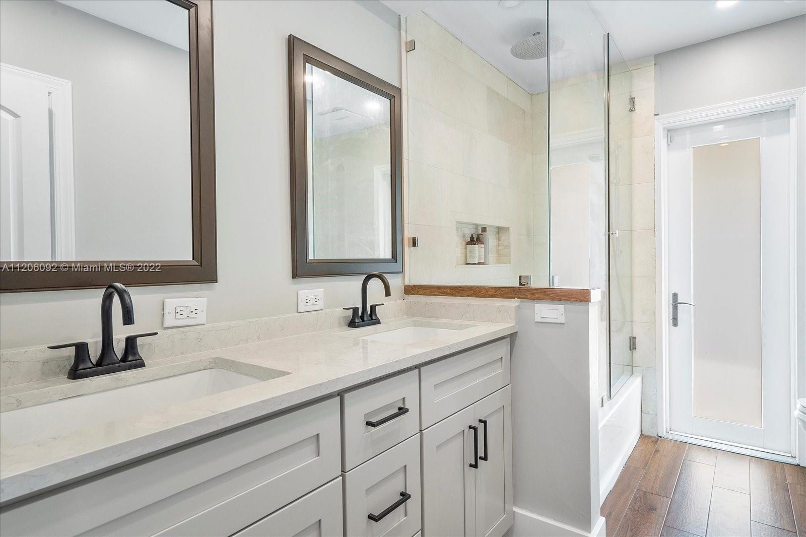 17300 Southwest 294th Street Homestead, FL 33030 - Photo 25 of 50 a bathroom with double sink and a mirror