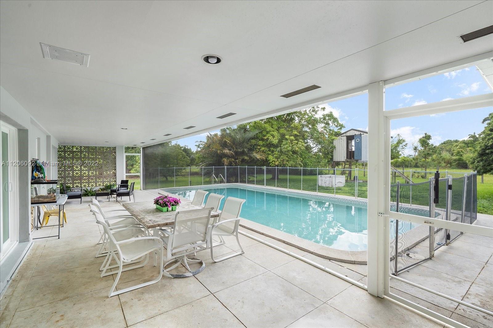 17300 Southwest 294th Street Homestead, FL 33030 - Photo 36 of 50 a outdoor space with furniture