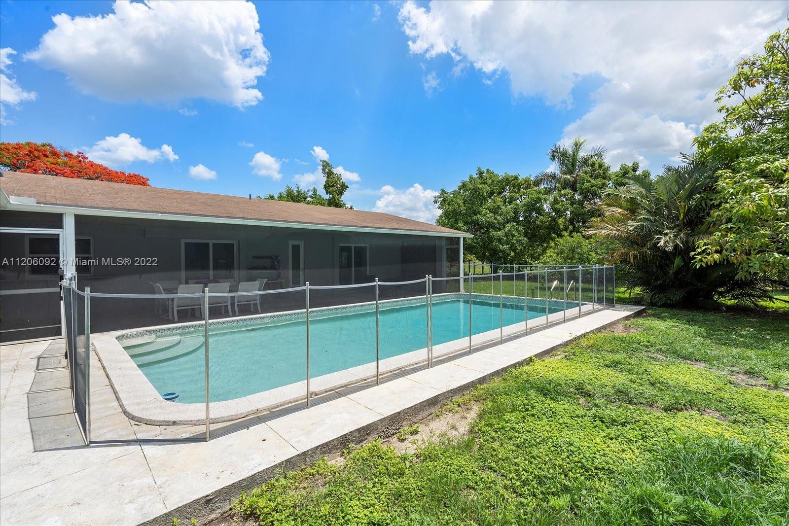 17300 Southwest 294th Street Homestead, FL 33030 - Photo 39 of 50 a view of outdoor space and swimming pool