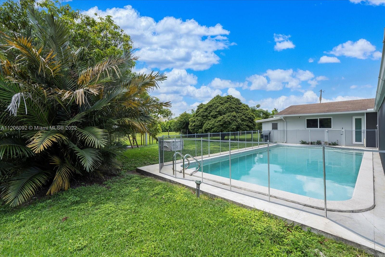 17300 Southwest 294th Street Homestead, FL 33030 - Photo 41 of 50 a view of backyard with a swimming pool and sitting area