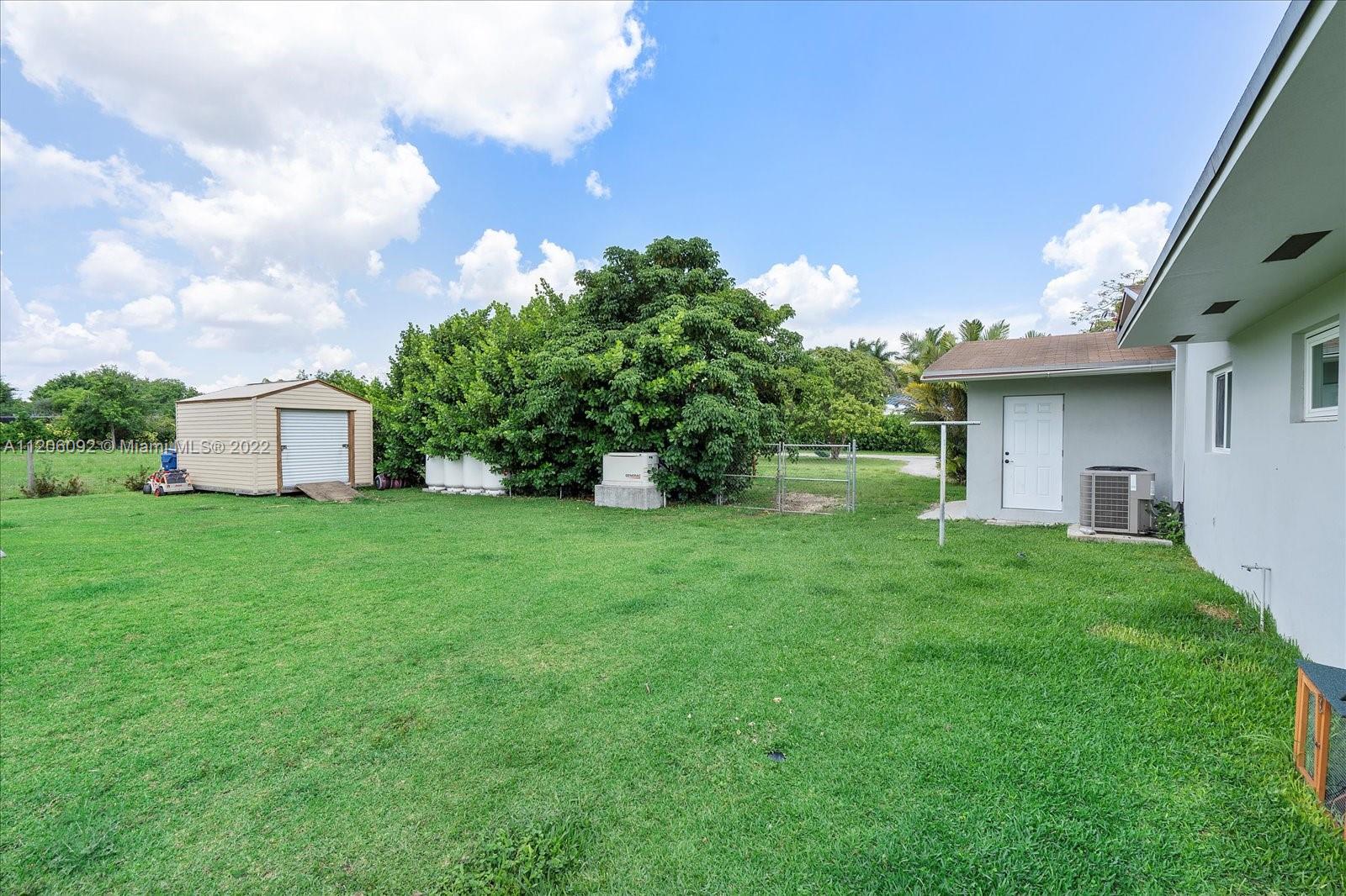 17300 Southwest 294th Street Homestead, FL 33030 - Photo 43 of 50 a view of a house with backyard and garden