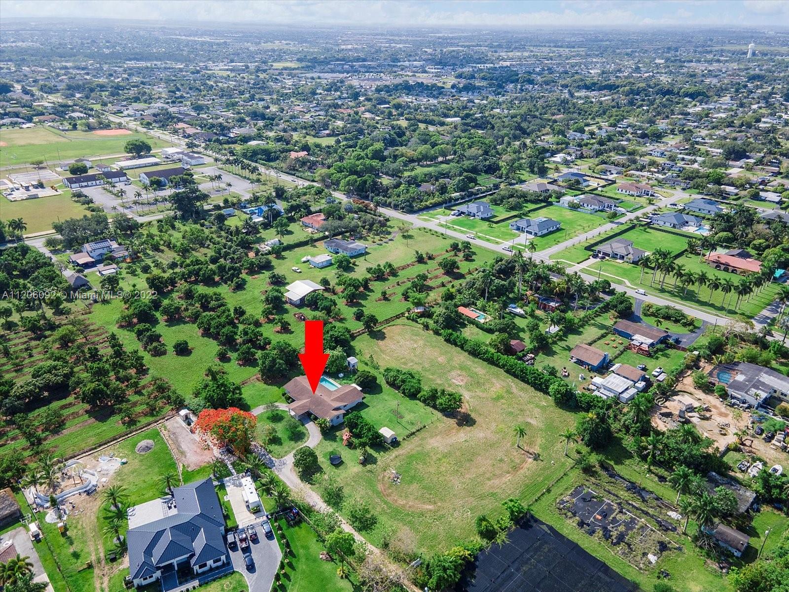 17300 Southwest 294th Street Homestead, FL 33030 - Photo 44 of 50 an aerial view of residential houses with outdoor space and trees