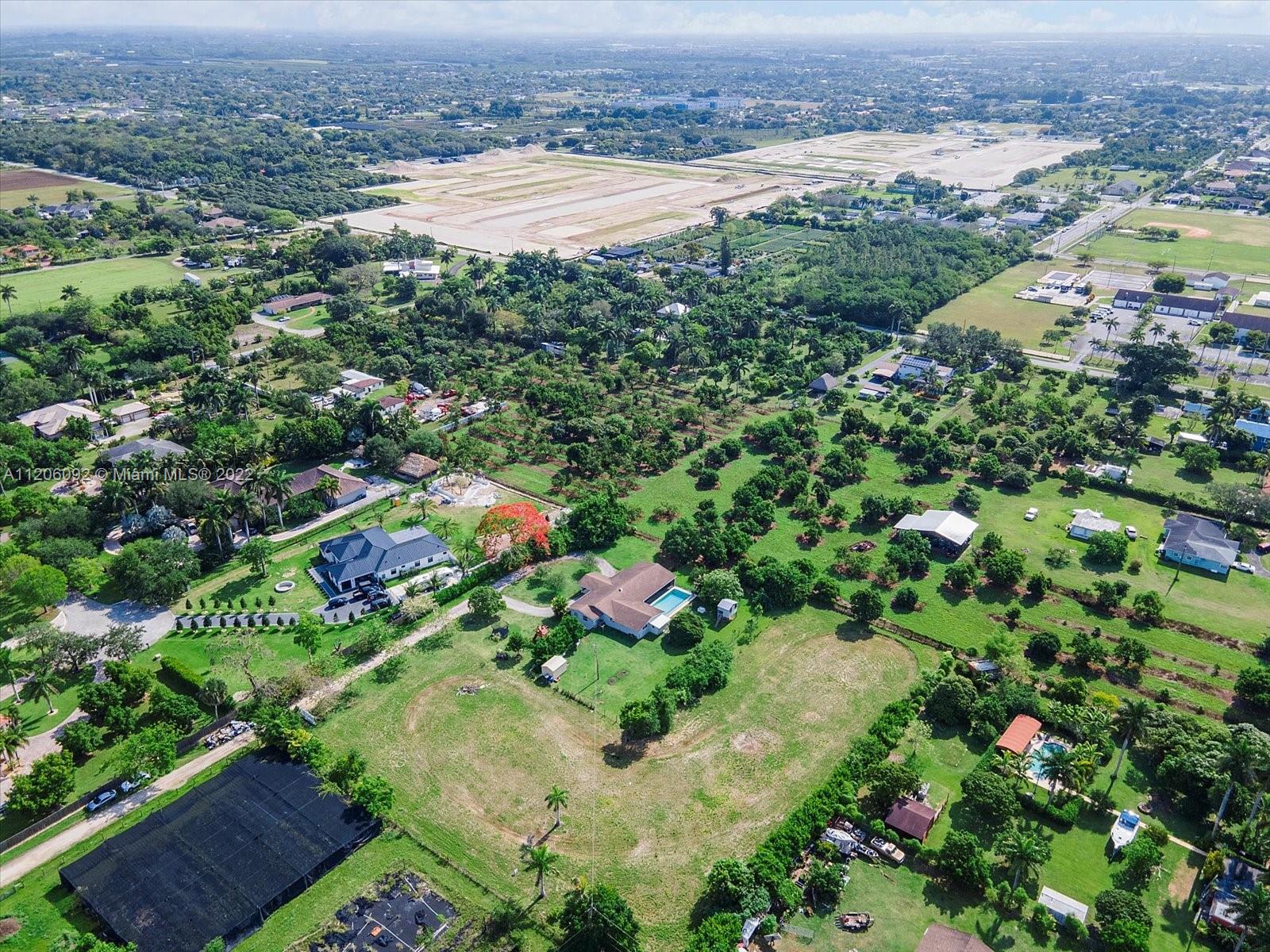17300 Southwest 294th Street Homestead, FL 33030 - Photo 46 of 50 an aerial view of residential houses with outdoor space and trees