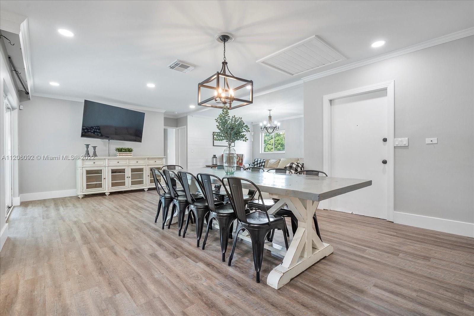 17300 Southwest 294th Street Homestead, FL 33030 - Photo 10 of 50 a view of a dining room with furniture window and wooden floor