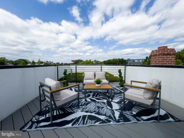a view of a terrace with seating area