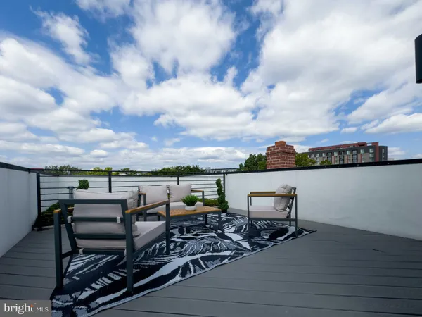 a view of a terrace with sitting area
