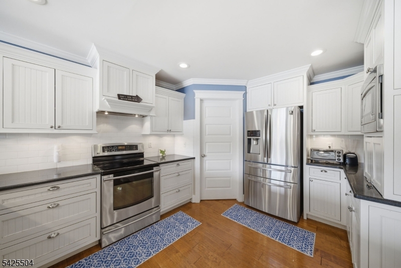 84 West Shore Road Denville, NJ 07834 - Photo 12 of 50 a kitchen with stainless steel appliances a refrigerator sink and stove