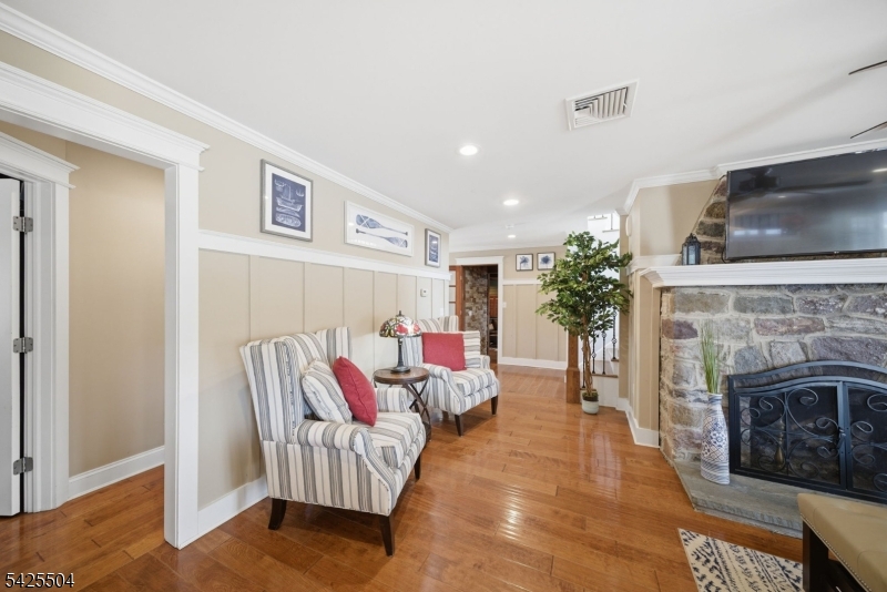 84 West Shore Road Denville, NJ 07834 - Photo 15 of 50 a living room with furniture fireplace and flat screen tv