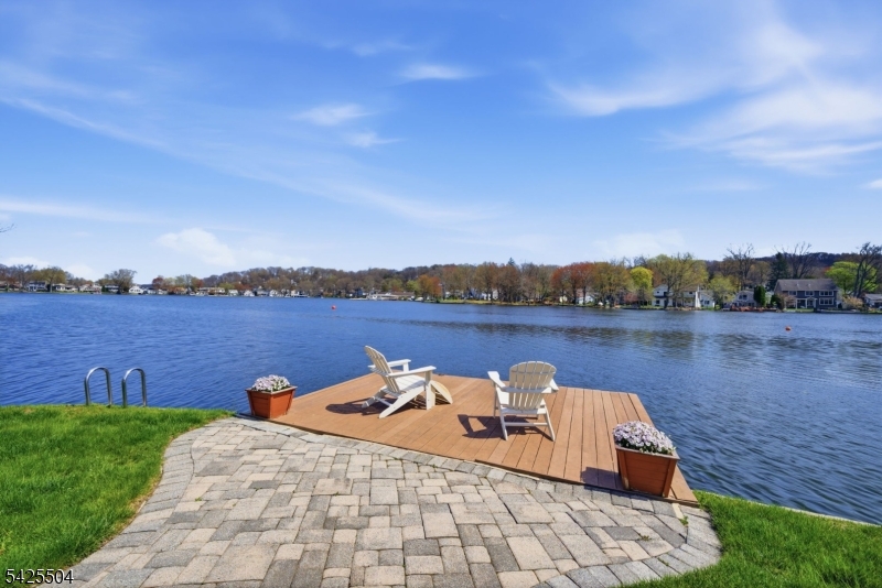 84 West Shore Road Denville, NJ 07834 - Photo 3 of 50 a view of a lake with houses in the back