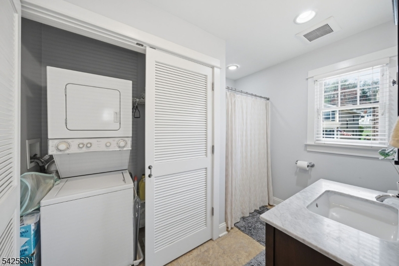 84 West Shore Road Denville, NJ 07834 - Photo 46 of 50 a bathroom with a sink a toilet and a window
