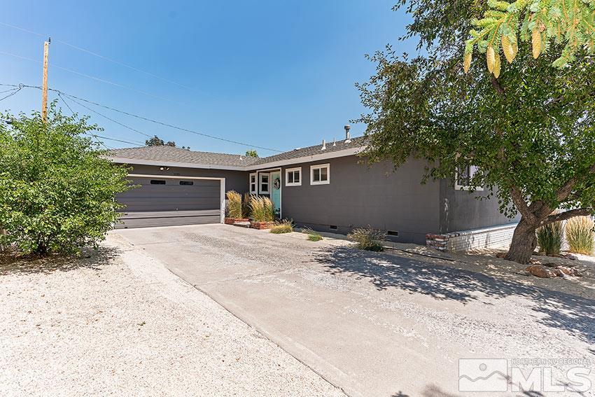 1999 Marlette Avenue Reno, NV 89503 - Photo 3 of 15 a front view of a house with a yard and garage
