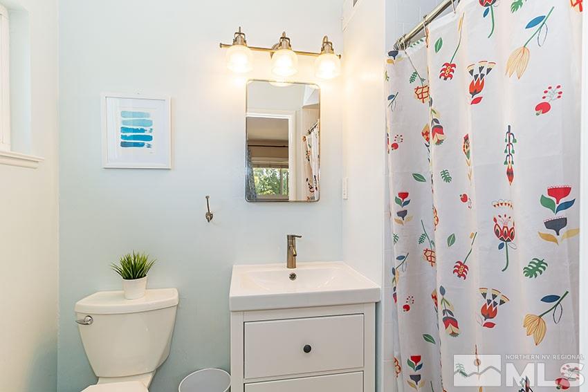 1999 Marlette Avenue Reno, NV 89503 - Photo 4 of 15 a bathroom with a sink a toilet and a curtain
