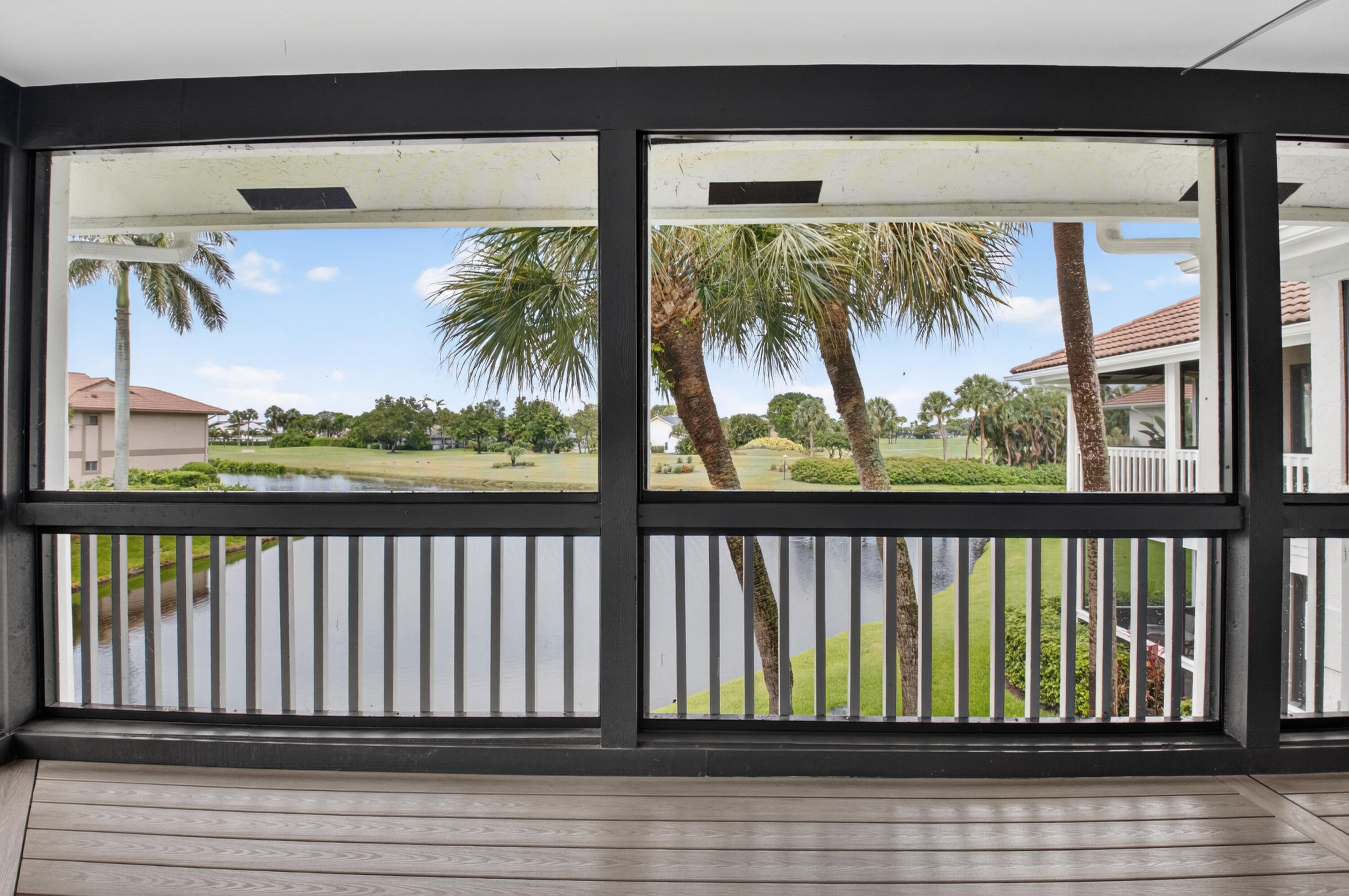 19221 Sabal Lake Drive, Unit 5124 Boca Raton, FL 33434 - Photo 24 of 98 a balcony with wooden floor and outdoor space