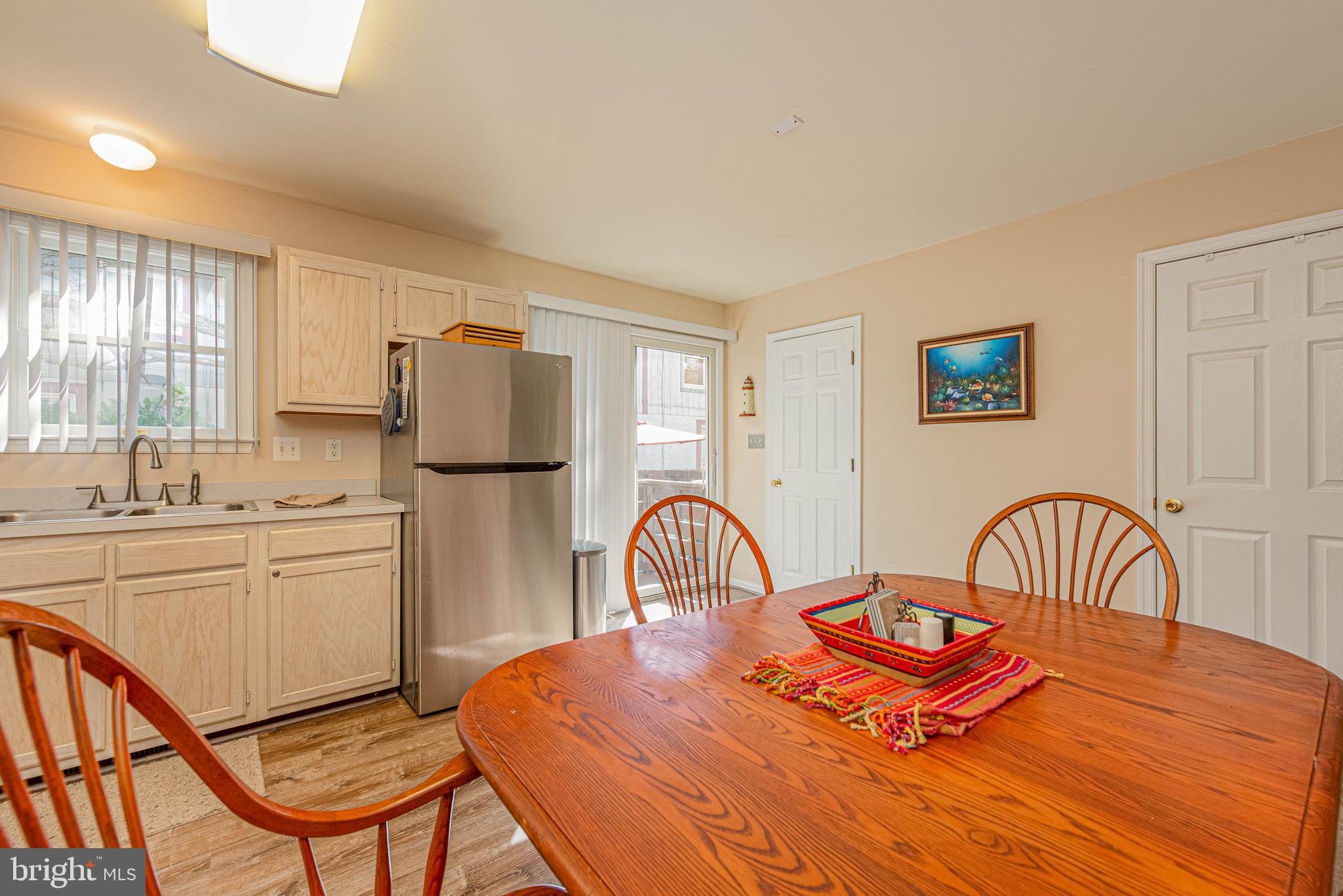 135 Captains Quarters Road Ocean City, MD 21842 - Photo 12 of 27 a dining room with furniture and window