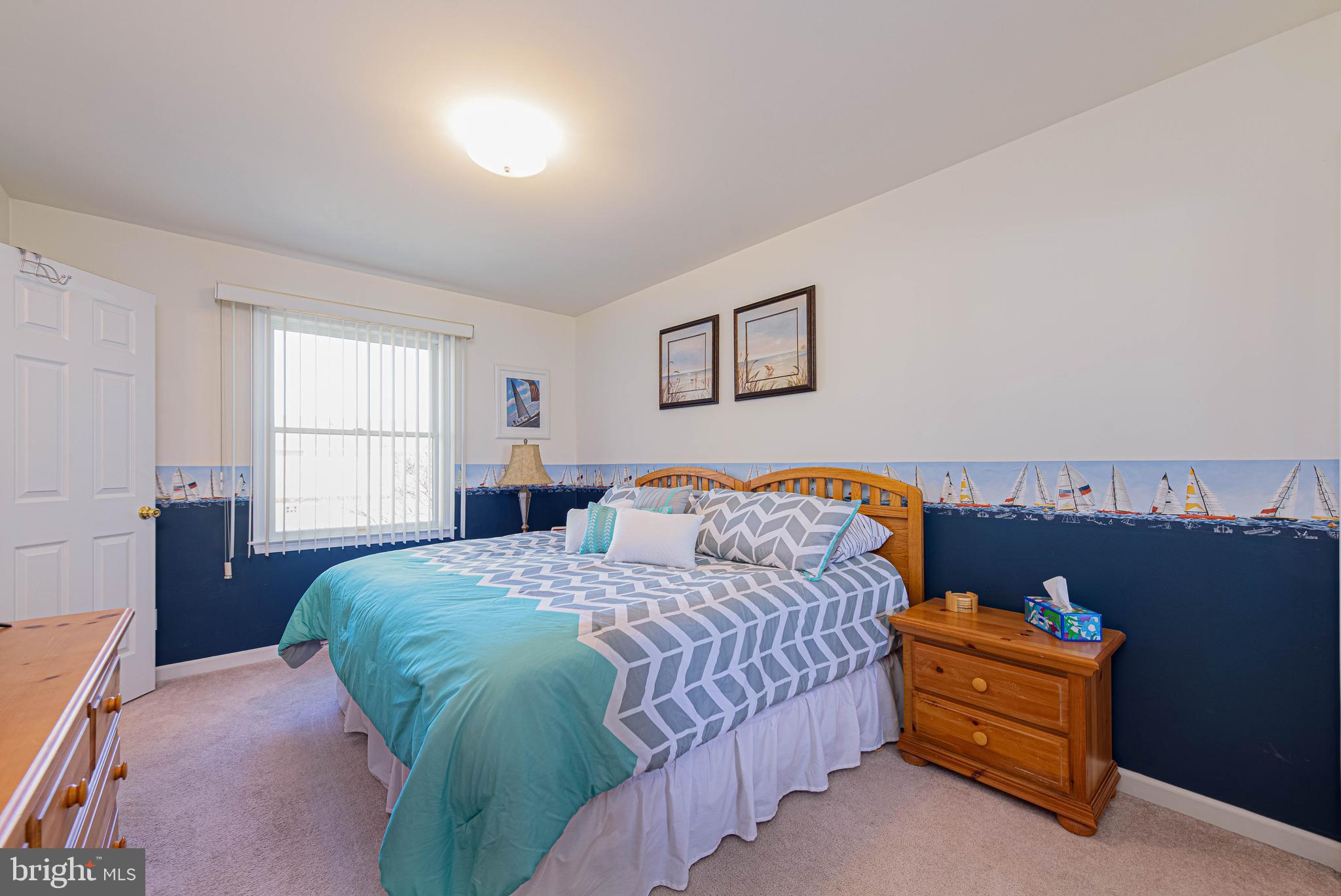 135 Captains Quarters Road Ocean City, MD 21842 - Photo 19 of 27 a bedroom with a bed and a couch