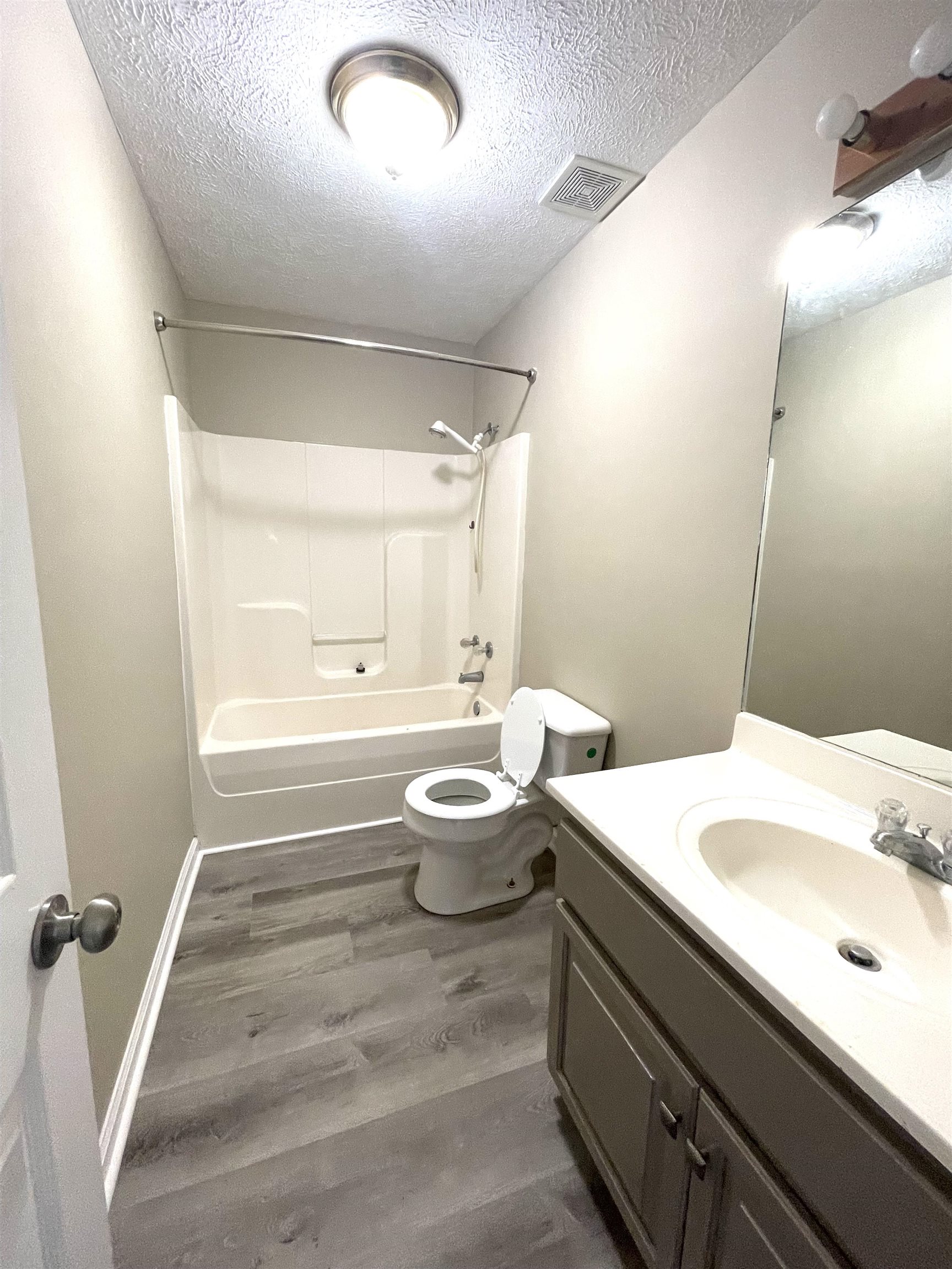 131 Wayne Elam Road Ramer, TN 38367 - Photo 12 of 15 a bathroom with a sink a toilet a tub and shower