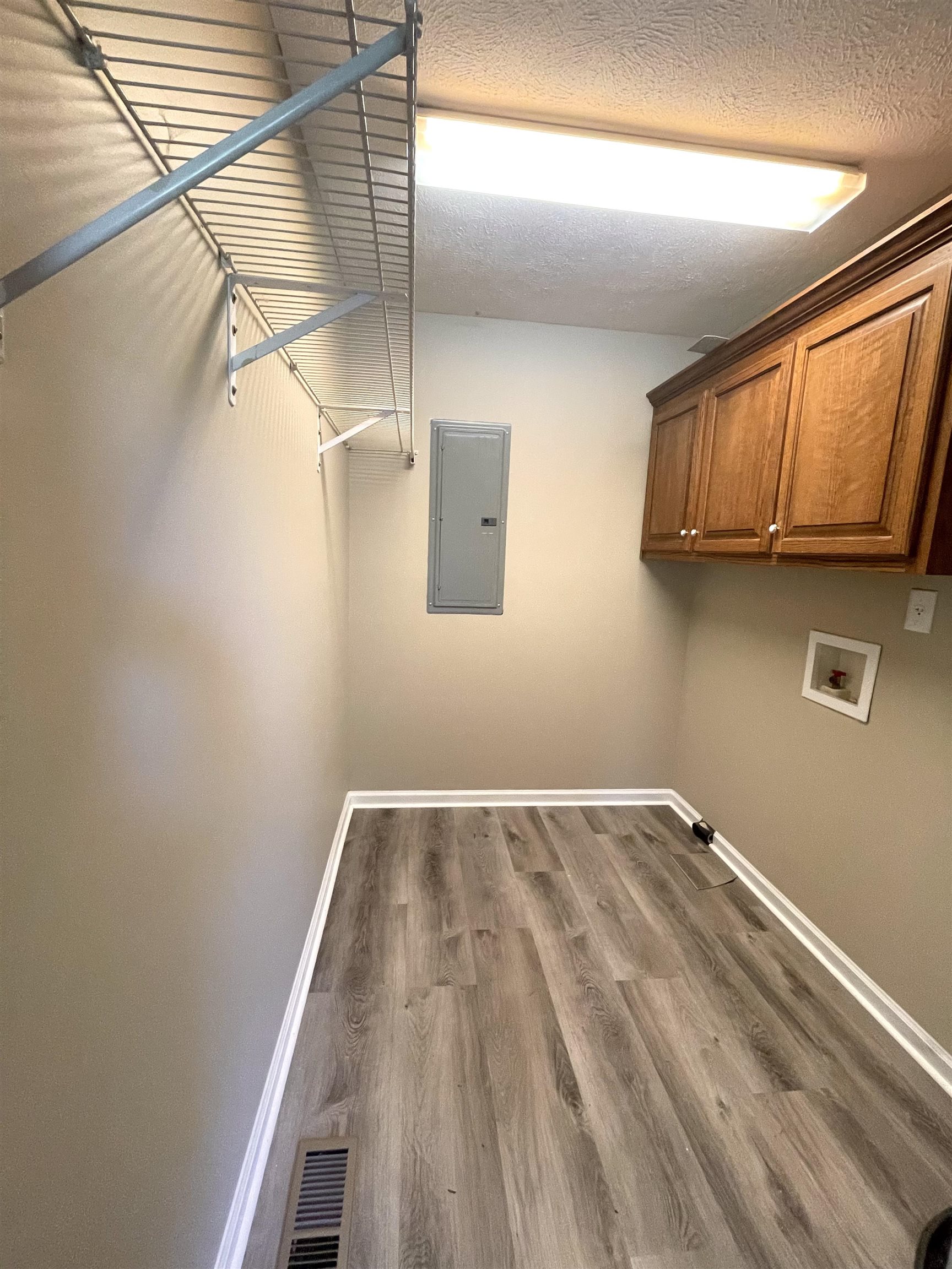 131 Wayne Elam Road Ramer, TN 38367 - Photo 13 of 15 a view of a room with wooden floor and cabinet