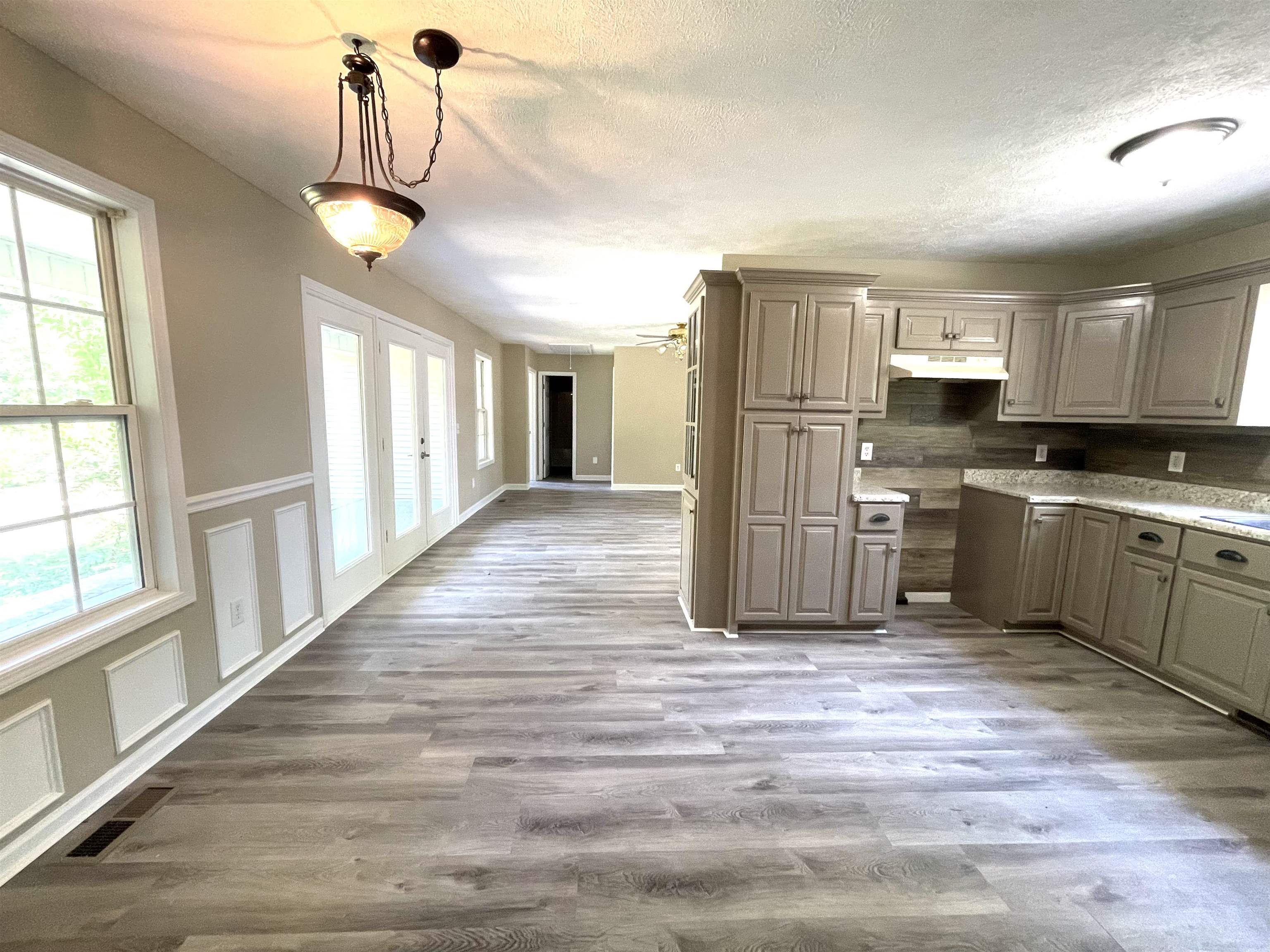 131 Wayne Elam Road Ramer, TN 38367 - Photo 4 of 15 a view of a kitchen with a stove cabinets and a living room
