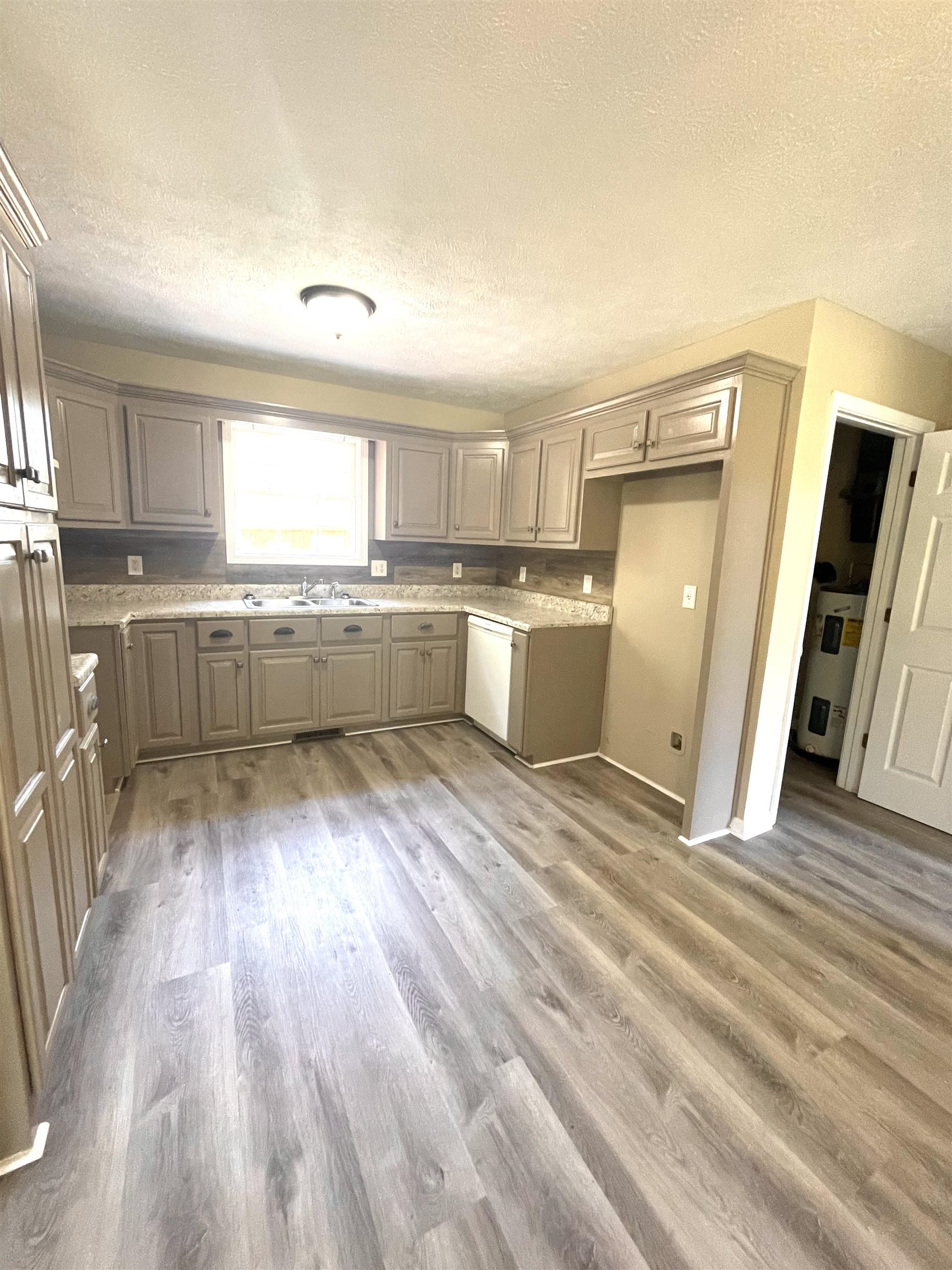 131 Wayne Elam Road Ramer, TN 38367 - Photo 5 of 15 a kitchen with refrigerator and window