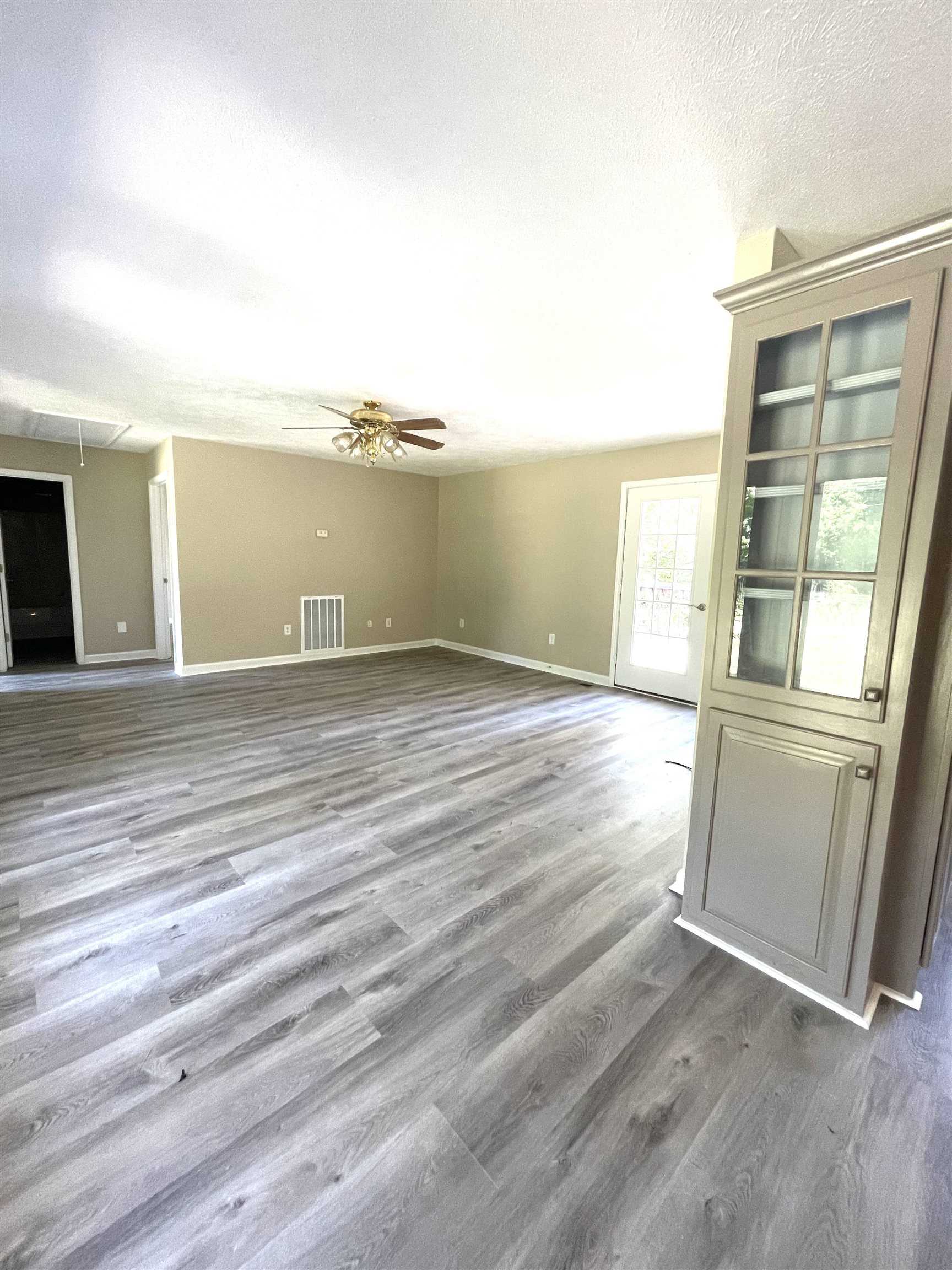 131 Wayne Elam Road Ramer, TN 38367 - Photo 6 of 15 a view of a room with wooden floor