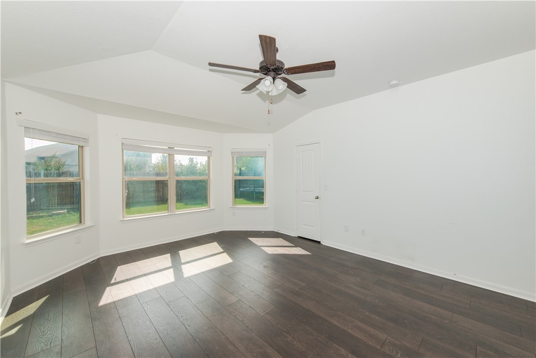 1007 Plateau Trail Georgetown, TX 78626 - Photo 12 of 32 wooden floor in an empty room with a window