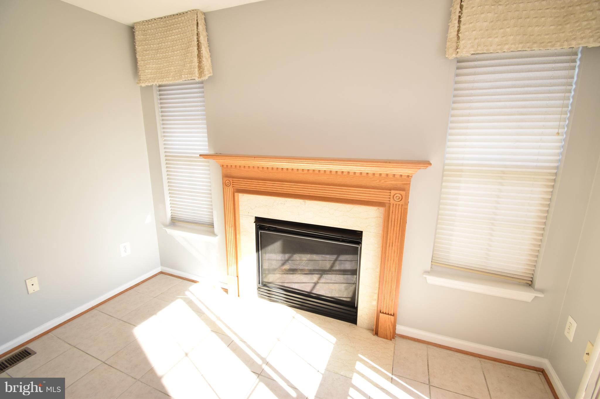 207 Canvasback Way Cambridge, MD 21613 - Photo 13 of 30 a living room with a fireplace in it