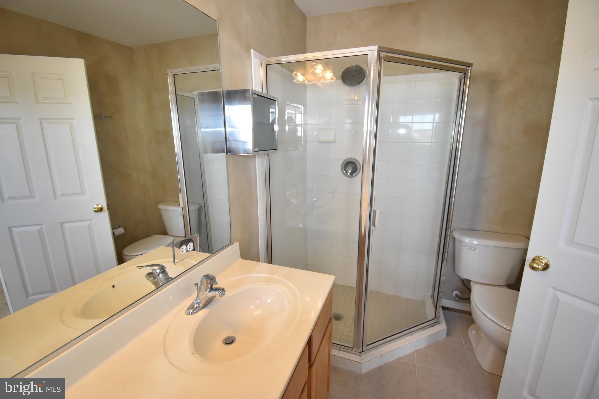 207 Canvasback Way Cambridge, MD 21613 - Photo 20 of 30 a bathroom with a sink and shower