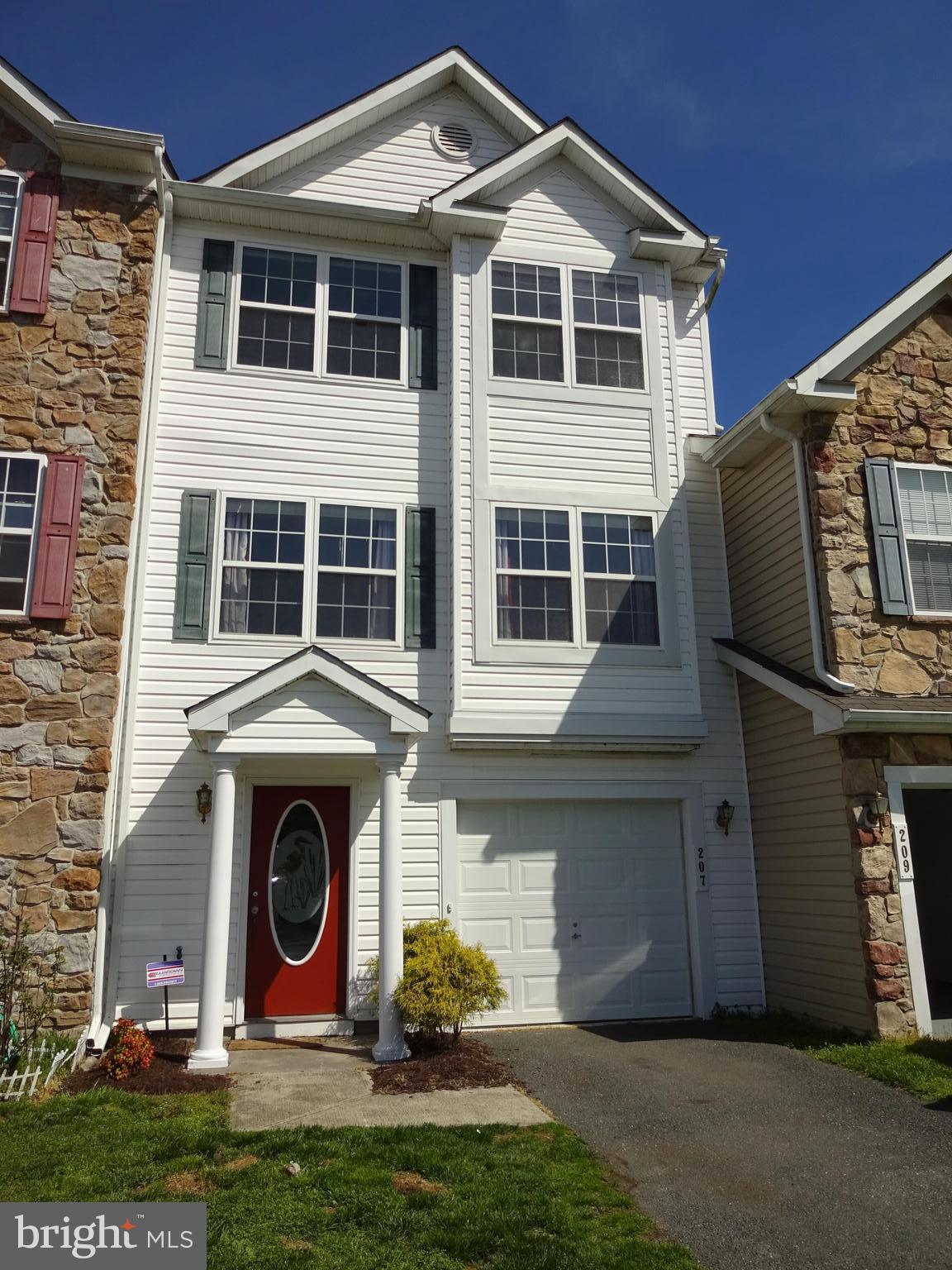 207 Canvasback Way Cambridge, MD 21613 - Photo 2 of 30 a front view of a house with garden