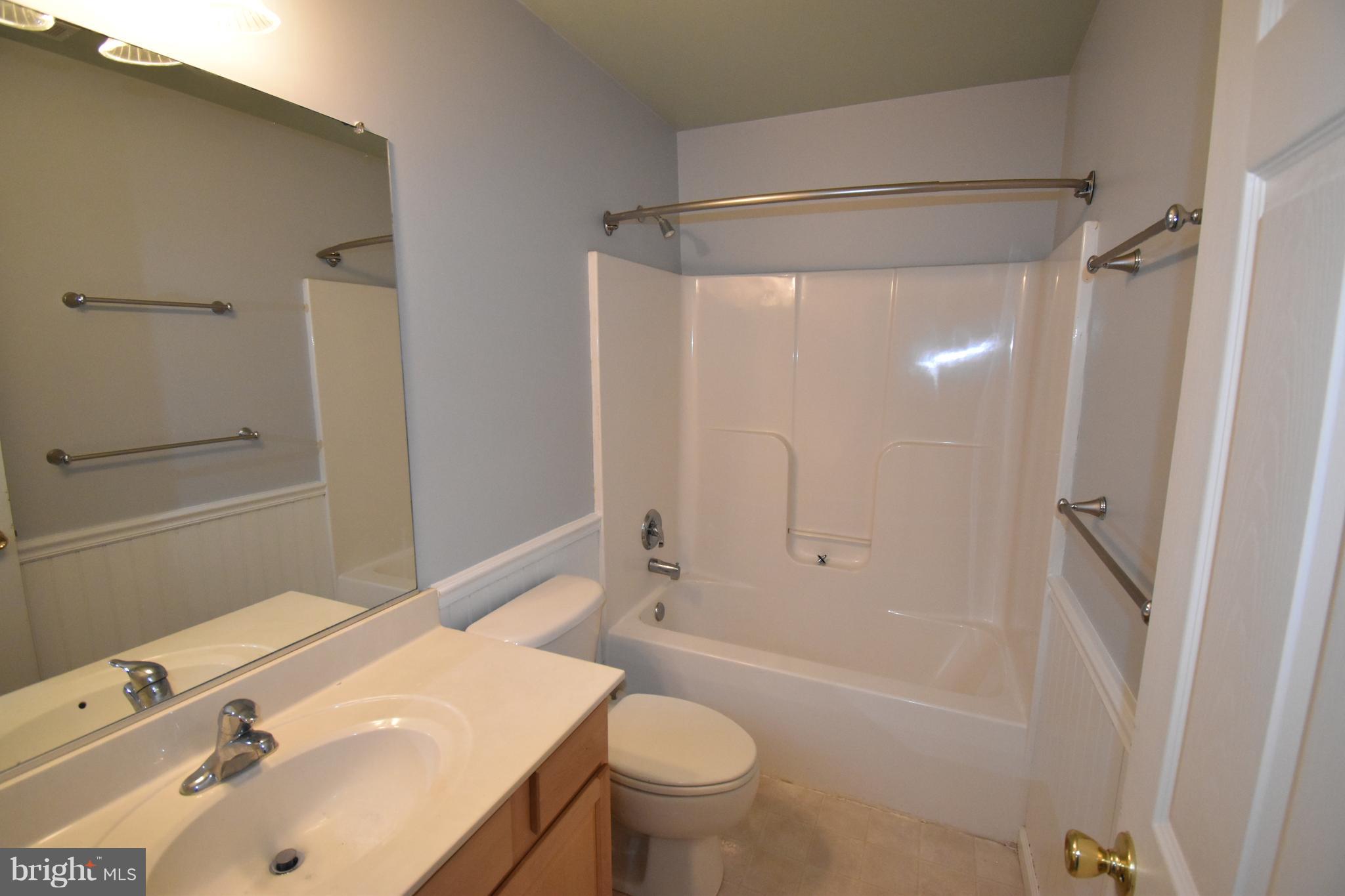207 Canvasback Way Cambridge, MD 21613 - Photo 23 of 30 a bathroom with a sink toilet and shower