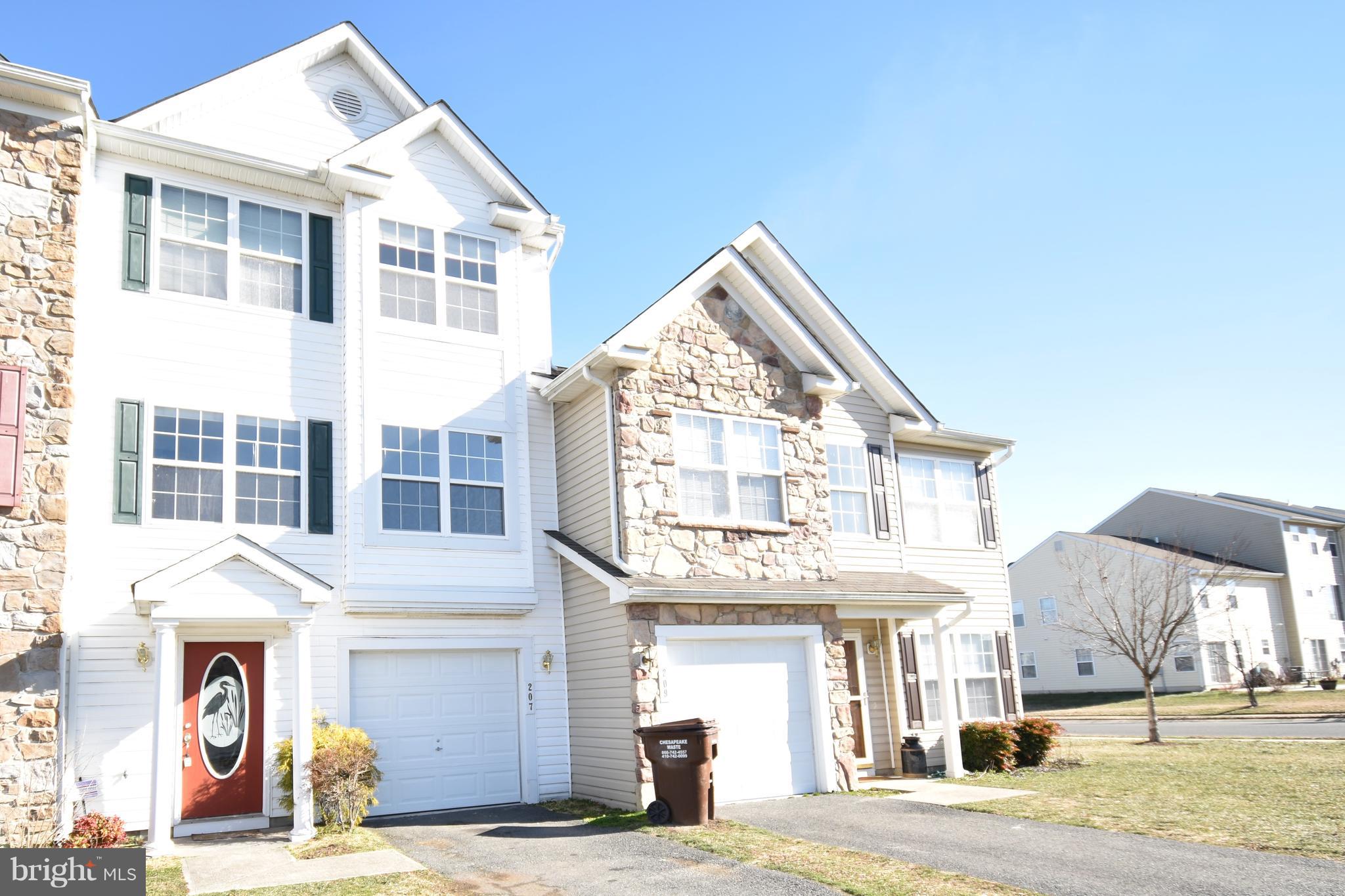 207 Canvasback Way Cambridge, MD 21613 - Photo 26 of 30 a view of a white building among the street and a building