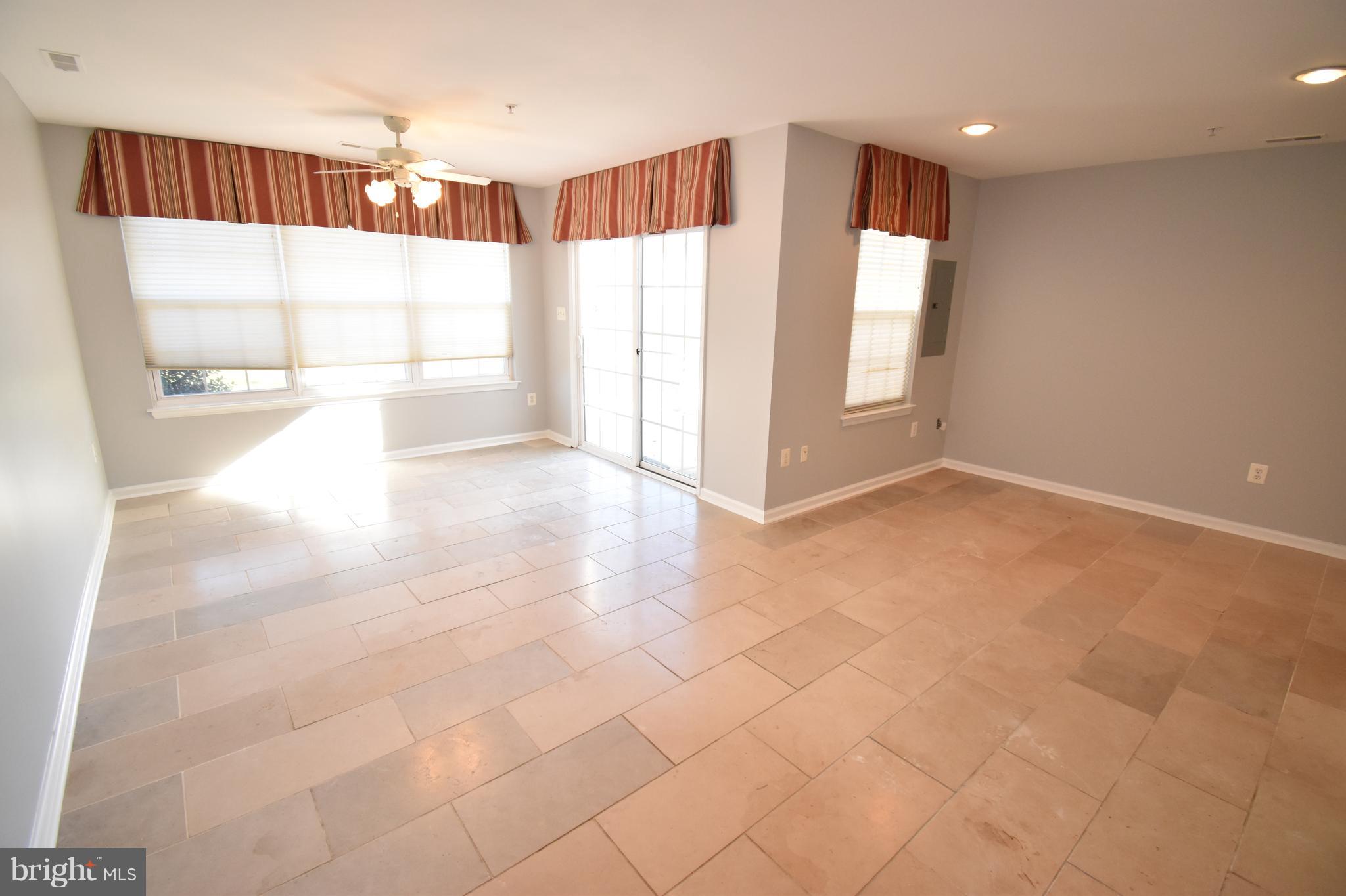 207 Canvasback Way Cambridge, MD 21613 - Photo 4 of 30 a view of an empty room with a window