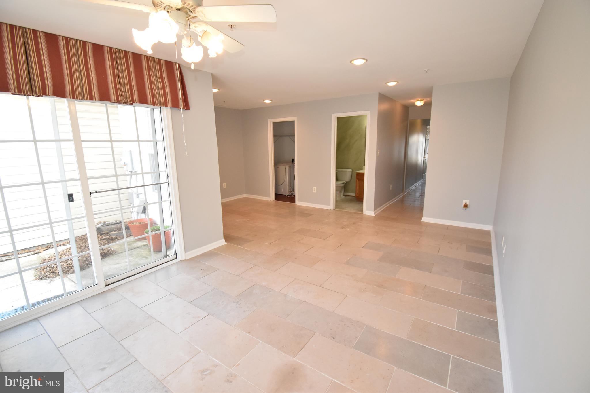 207 Canvasback Way Cambridge, MD 21613 - Photo 5 of 30 a view of an empty room with a window
