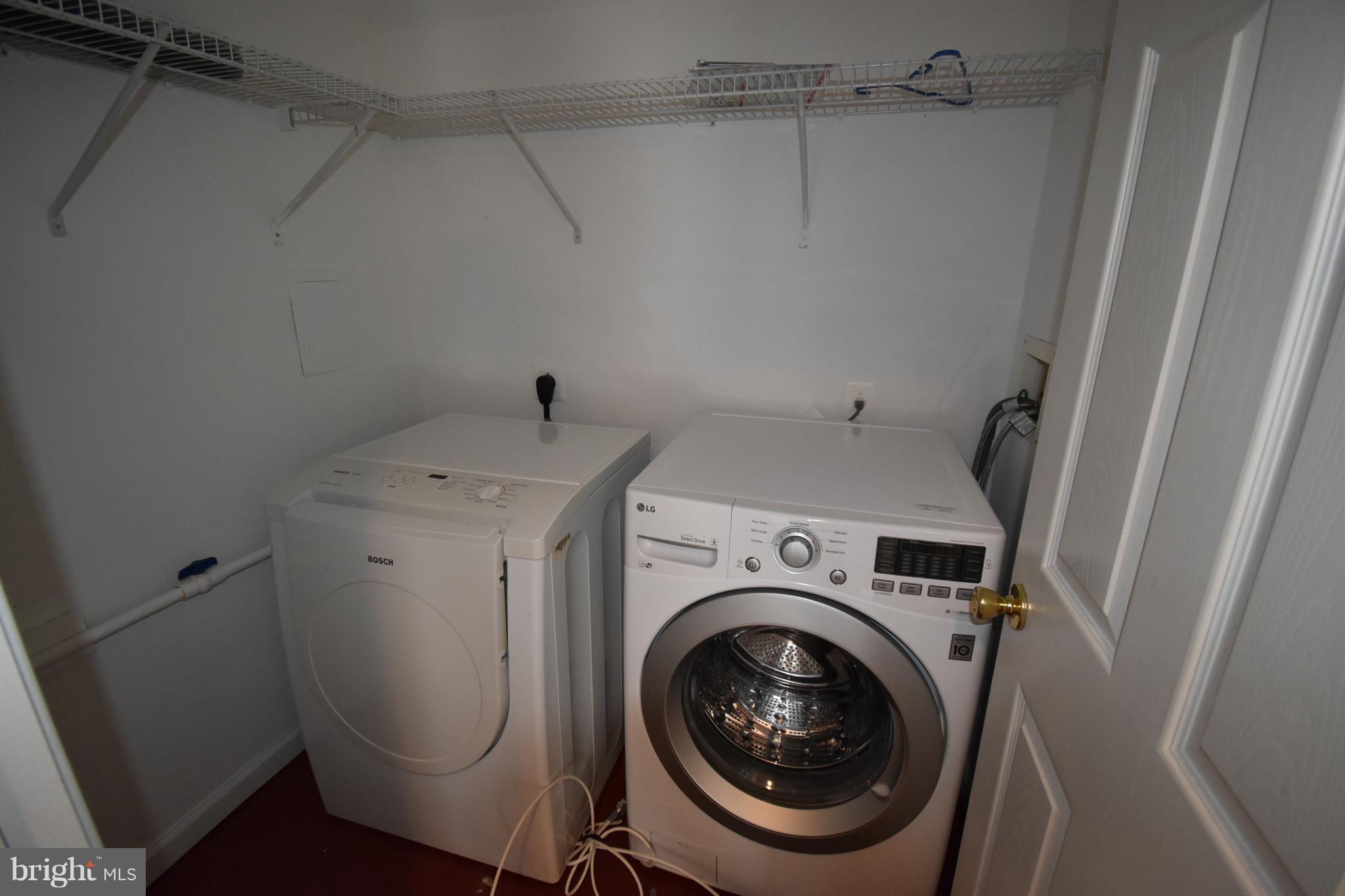 207 Canvasback Way Cambridge, MD 21613 - Photo 6 of 30 a utility room with dryer and washer