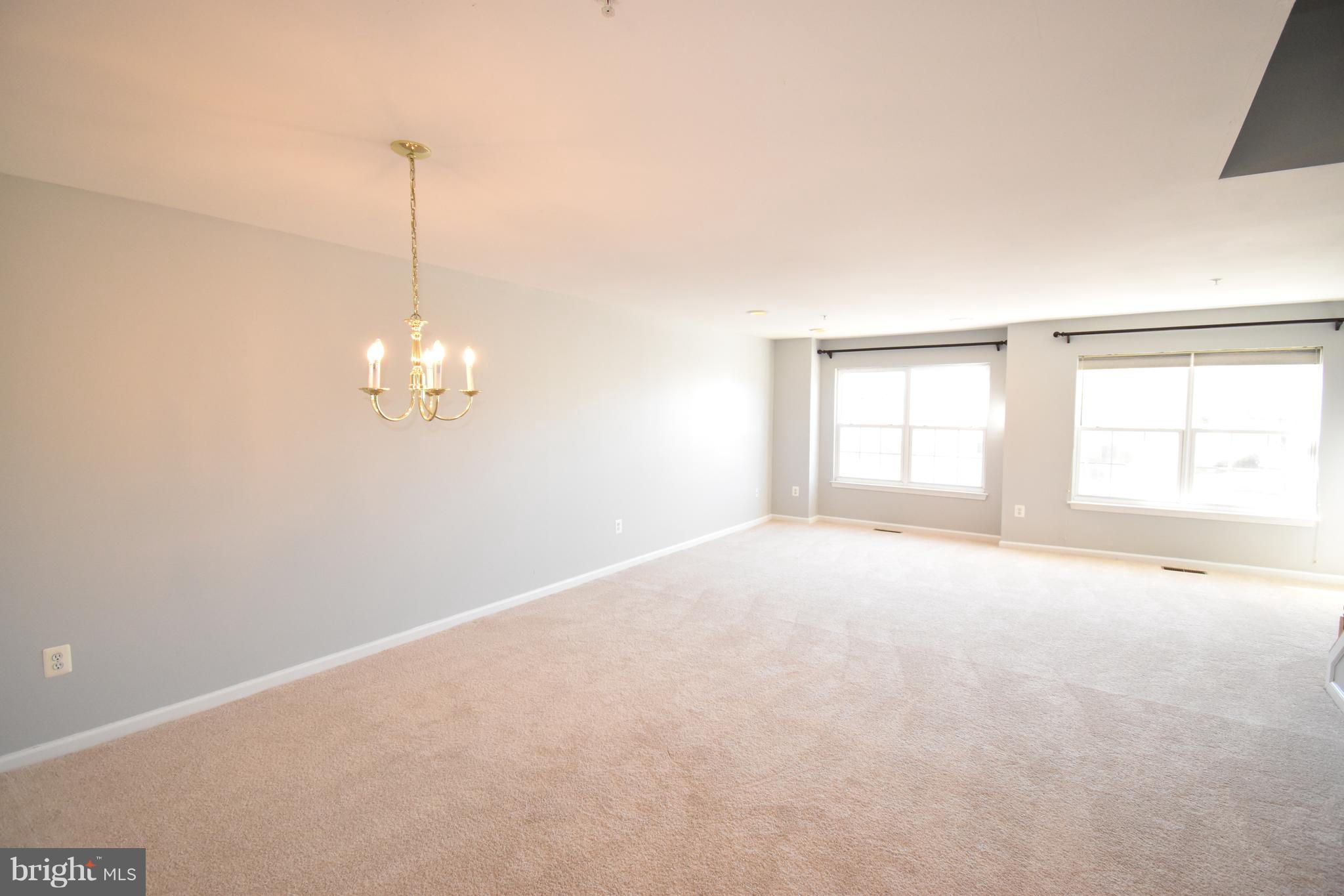 207 Canvasback Way Cambridge, MD 21613 - Photo 8 of 30 a view of an empty room with a window