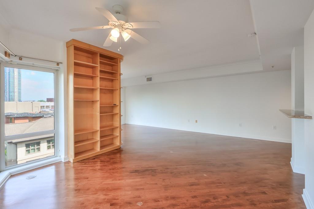 3475 Oak Valley Road Northeast, Unit 530 Atlanta, GA 30326 - Photo 17 of 37 wooden floor in an empty room with a window