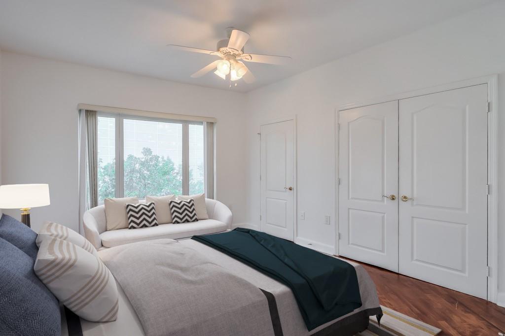 3475 Oak Valley Road Northeast, Unit 530 Atlanta, GA 30326 - Photo 19 of 37 a bedroom with bed and a window