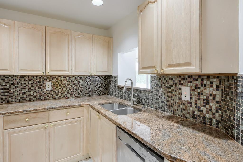 3475 Oak Valley Road Northeast, Unit 530 Atlanta, GA 30326 - Photo 28 of 37 a kitchen with granite countertop a sink and a white stove