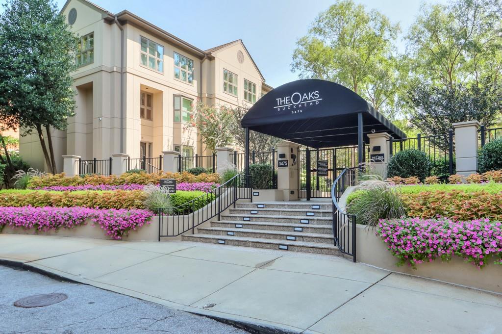 3475 Oak Valley Road Northeast, Unit 530 Atlanta, GA 30326 - Photo 5 of 37 a front view of a building with an outdoor space