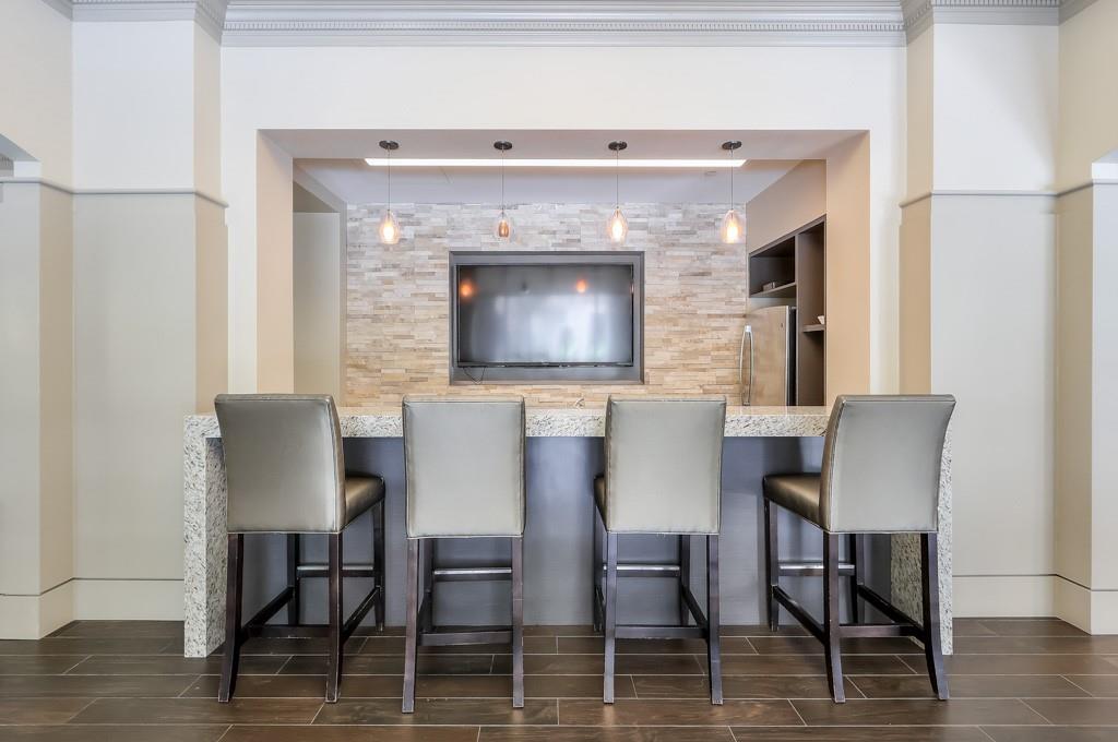 3475 Oak Valley Road Northeast, Unit 530 Atlanta, GA 30326 - Photo 8 of 37 a view of a dining room with furniture and wooden floor