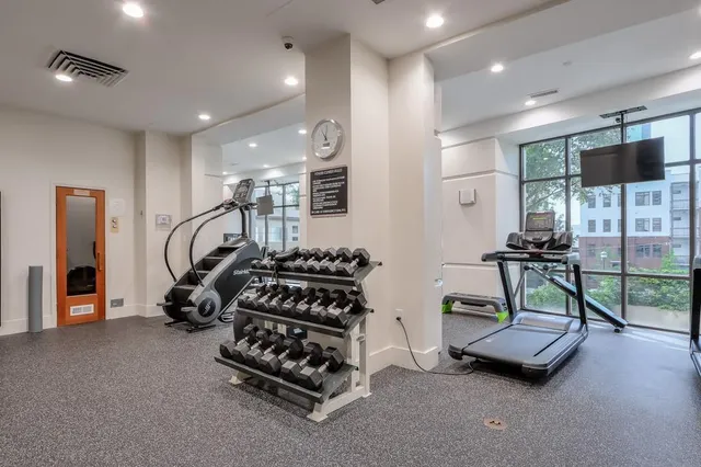 a bedroom with furniture and a flat screen tv